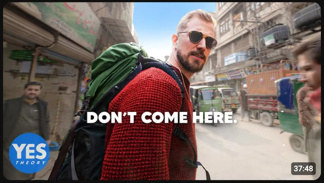 Yes Theory YouTube thumbnail showing a backpacker walking through a busy street with the text DON'T COME HERE