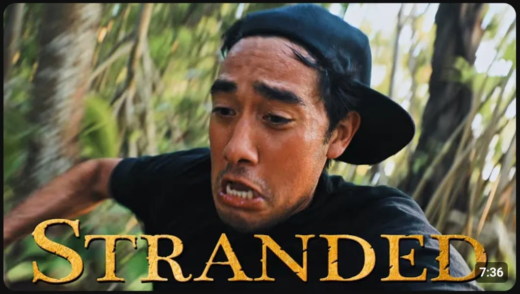 Zach King YouTube thumbnail showing a worried facial expression in a forest with the word STRANDED in large gold text